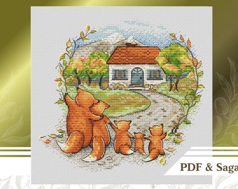 May include: Cross stitch pattern featuring a family of foxes walking towards a small white house with a red roof. The house is surrounded by trees and a path. The pattern is in a circular frame with a green background.