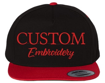 May include: Black and red baseball cap with the text "CUSTOM Embroidery" in red embroidery on the front.