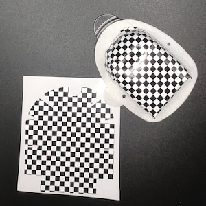 May include: A black and white checkered pattern paper template for a gift box. The template is designed to be folded and assembled into a box.