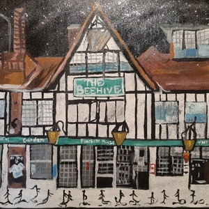 May include: A painting of a pub called "The Beehive" with a white facade and black trim. The pub has a sign with the name of the pub in green letters. The pub is surrounded by a snowy landscape.