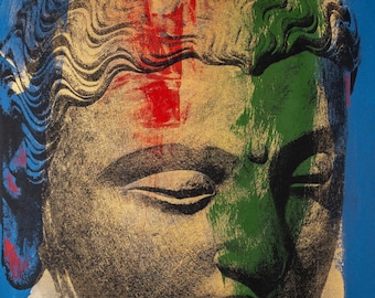 Puede incluir: Una colorida representación de un rostro de Buda al estilo pop art. La obra presenta un fondo azul con la cabeza pintada con pinceladas doradas, verdes, rojas y azules. Los ojos del Buda están cerrados, y el estilo general recuerda una serigrafía.