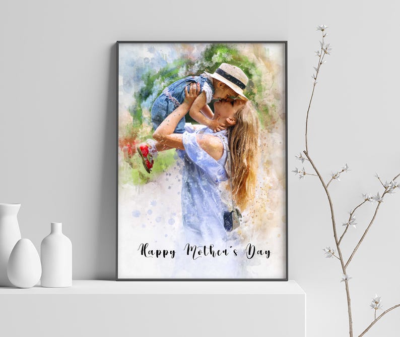 May include: A watercolor painting of a mother and child. The mother is holding the child in the air and they are kissing. The child is wearing a blue shirt and a straw hat. The mother is wearing a blue dress. The background is a watercolor wash of green and blue. The text "Happy Mother's Day" is written at the bottom of the painting.