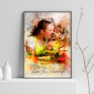 May include: A watercolor painting of a mother and daughter sharing a meal. The mother is wearing a yellow apron and the daughter is wearing a pink shirt. The painting is set against a background of colorful vegetables and the text "Love You Mommy!" is written in the bottom right corner.