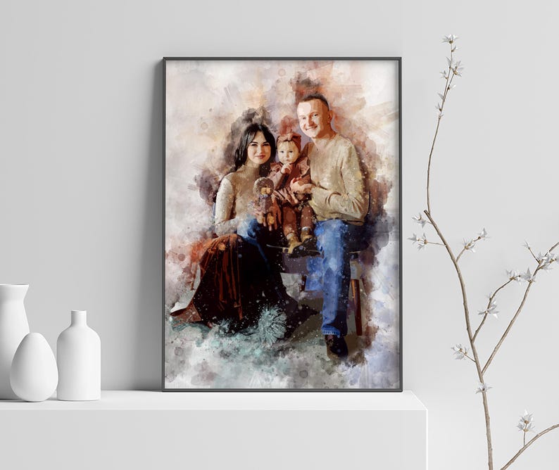 May include: A watercolor painting of a family of three. A man, woman, and child are sitting together. The man is wearing a beige sweater and blue jeans. The woman is wearing a brown dress and the child is wearing a pink dress. The painting has a soft, dreamy feel.