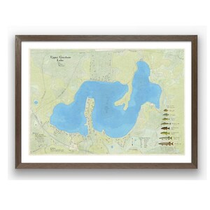 May include: A vintage-style map of Upper Graham Lake, showing the lake's shape, depth contours, and surrounding land features. The map also includes a key with different fish species found in the lake, such as bass, pike, and walleye.