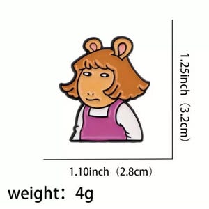 May include: A cartoon enamel pin of a brown-haired girl with a pink dress. The pin is 1.10 inches wide and 1.25 inches tall. It weighs 4 grams.