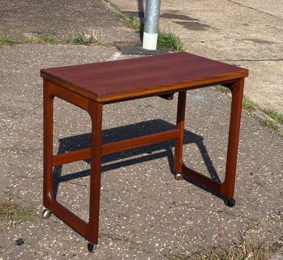 Mcintosh 1960/70’s Teak Side Table with fold over extendable top on castors