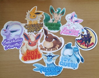 May include: Nine colorful stickers featuring different Pokemon characters with various phrases, including "Sashay Away", "Hot Stuff", "Basic But Cute", "Lenf Me Alone", "Fucking Fabulous", "Not Just a Phase", "Icy Queen", "Perfectly Moist", and "Current Mood".