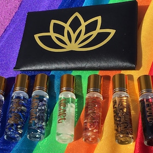 Chakra Inspired Set of 7 Essential Oil Rollerball Blends with Energy Charged Crystals and Handmade Lotus Flower Case