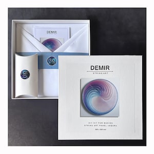 May include: A white square box containing a DIY string art kit labeled DEMIR STRING ART. The kit includes a 300 x 300 mm panel, a small pillow box, and a circular graphic featuring a blue, purple, and white spiral string pattern.