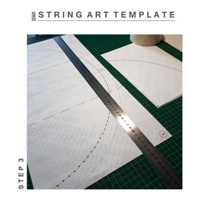 May include: A step-by-step guide for creating string art. The image shows two pieces of paper with dotted lines and a ruler. The text "STEP 3" and "STRING ART TEMPLATE" are visible.