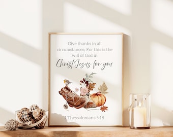 May include: A printable wall art design with a watercolor illustration of a boot, a pumpkin, and fall leaves. The text reads "Give thanks in all circumstances; For this is the will of God in Christ Jesus for you 1 Thessalonians 5:18".