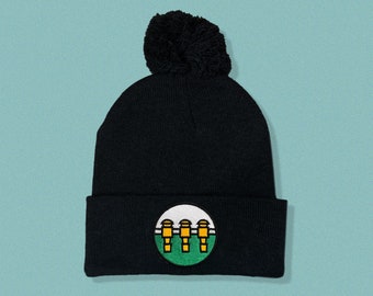 Three Rod Barrage Embroidered Black Pom Pom Beanie