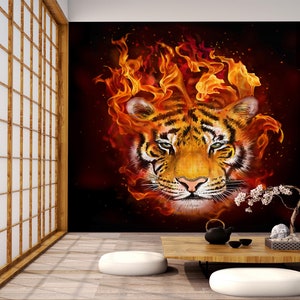 May include: A tiger's face is surrounded by flames, creating a dramatic and fiery image. The tiger's fur is orange and black, and its eyes are piercing.