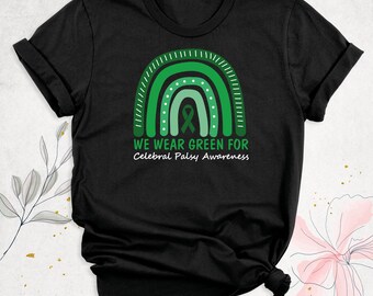 May include: A black short-sleeved t-shirt featuring a graphic of a green rainbow with a central awareness ribbon. Below the rainbow, the text reads WE WEAR GREEN FOR Cerebral Palsy Awareness in green and white lettering.