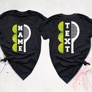 May include: Two black t-shirts with a white tennis racket and yellow tennis balls. The text "NAME" and "TEXT" are spelled vertically using the tennis balls.