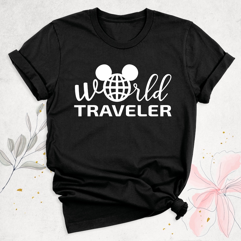 May include: Black t-shirt with a white graphic of Mickey Mouse ears with a globe inside the ears and the text "World Traveler" underneath.