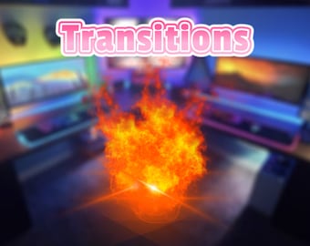 May include: A blurry image of a computer desk with a large, bright orange and yellow flame in the center. The text "Transitions" is in pink at the top of the image.