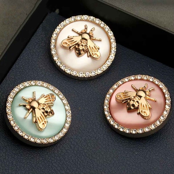 4 Buzz Bee Round Metal Shank buttons embellished with rhinestones and Faux pearls surface.