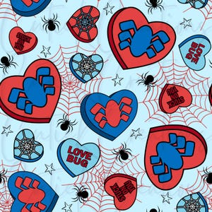 May include: A repeating pattern on a light blue background featuring red and blue heart-shaped candies with spider and web designs. Some hearts have text that reads "Love Bug" and "Stuck on You". Black spiders and white stars are also scattered throughout.