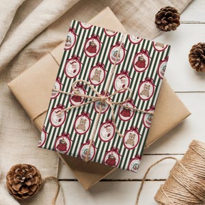 May include: A wrapped gift with Christmas-themed wrapping paper. The paper features a pattern of ornaments with Santa Claus, teddy bears, and gift bags on a green and white striped background. The gift is tied with twine.