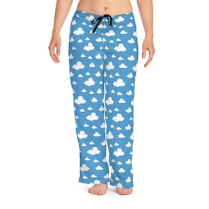 May include: Blue pyjama trousers with a white cloud pattern.