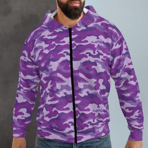 May include: A purple camouflage print zip-up hoodie with a black zipper.