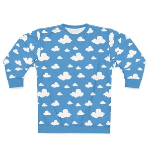May include: A blue sweatshirt with a white cloud pattern.