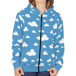 May include: A blue zip-up hoodie with a white cloud pattern.