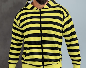 May include: A zip-up hoodie with a bold pattern of horizontal black stripes on a yellow background. The hoodie has a white interior lining in the hood and a full-length zipper. The cuffs and bottom hem are solid yellow.
