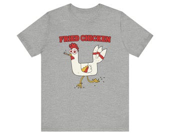 May include: A gray t-shirt with a cartoon chicken wearing sunglasses and smoking a cigarette. The text "Fried Chicken" is printed in red above the chicken.