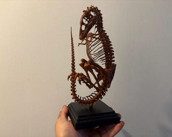 Tyrannosaurus Rex fetus skeleton replica on wooden base