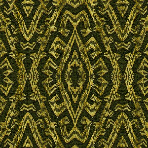 May include: A textile fabric featuring a repeating geometric pattern in dark forest green and vibrant golden yellow. The design consists of intricate, symmetrical diamond and angular shapes woven into the surface, creating a textured appearance.