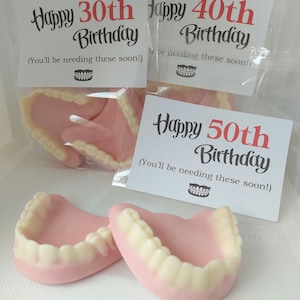 Happy Birthday 30th, 40th,50th,60th,70th,80th, 90th. Strawberry flavor fun life size joke gummy teeth. Old age joke gift for mum, dad, sister, brother, niece, nephew, friend. Happy Birthday design on a white label with age 30th 40th 50th 60th 70th 80th 90th