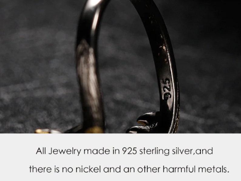 May include: Close-up of a silver ring with the inscription "925" on the inside band. The ring is made of 925 sterling silver and is nickel-free.