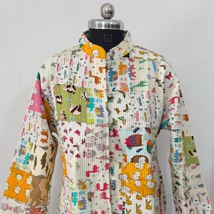 May include: A long-sleeved quilted jacket featuring a patchwork design with various colorful animal prints including pandas, elephants, and rabbits on a white background. The jacket has a mandarin collar, a front button closure, and two pockets.