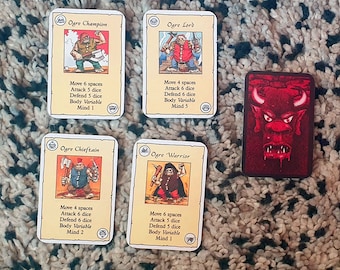 May include: Four fantasy role-playing game character cards featuring illustrations of ogres with axes and a red card with a red devil head illustration. The cards have text describing the character's stats, including move spaces, attack dice, defend dice, body variable, and mind.