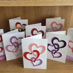 Quilled in elkaar grijpende hartkaart | Papiermodellen | Quilling | Blanco binnenkant | 8 ontwerpen