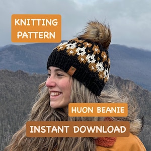 May include: A black, white, and tan knitted beanie with a faux fur pom-pom. The beanie has a geometric pattern and a small leather tag. Text on the image reads "Knitting Pattern", "Huon Beanie", and "Instant Download".