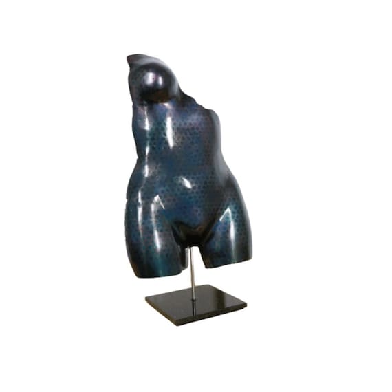 Handmade torso of a woman made of metal on natural stone base