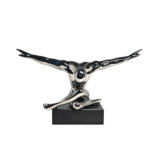 Sculpture "Flying Man" depicting a man in a meditative posture - Made of ceramic / porcelain coated in silver.