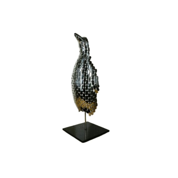 Art sculpture of a penguin made of stainless steel, highly polished