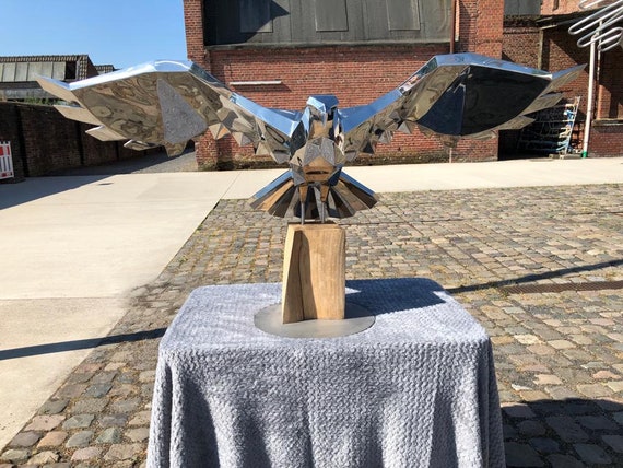 Highly polished stainless steel eagle on oak base