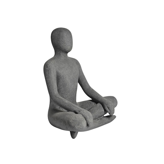 Seated man in a cross-legged position, made from a synthetic resin