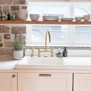 Unlacquered Brass Bridge Faucet With Linear Legs and flat Handles Kitchen Faucets