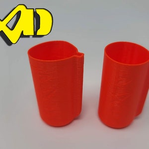 May include: Two bright orange plastic cups with a slightly rounded bottom and a seam on the side.