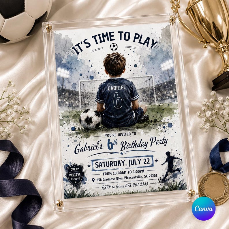 May include: A clear acrylic frame holds a soccer-themed birthday party invitation. The invitation features a watercolor illustration of a boy in a soccer uniform with the text "It's Time to Play." The invitation includes party details.