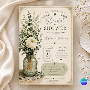 May include: A rectangular bridal shower invitation card with a cream-colored background. It features a bouquet of white flowers and green eucalyptus in a glass jar with a tag reading with love. Text includes Please join us for a Bridal Shower honoring Sophia Williams on Saturday May 24 2026 at 2:00 PM at The Garden Room 123 Bloomingdale Lane Nashville TN 37205.