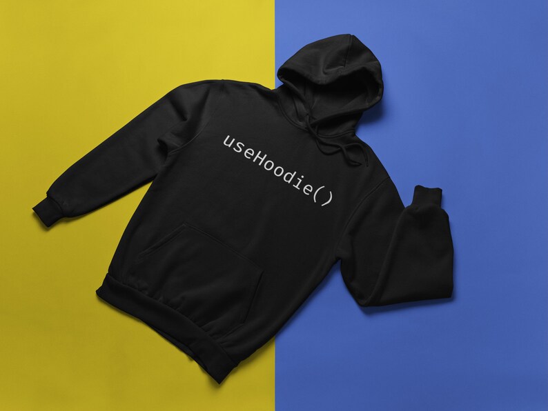 May include: Black hoodie with a white text design that says "useHoodie()" on a yellow and blue background.