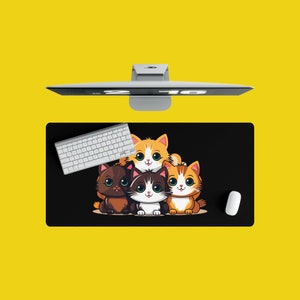 May include: A black mouse pad with a design of four cartoon cats. The cats are orange, brown, and white. The mouse pad is on a yellow surface. A white keyboard is also on the surface.